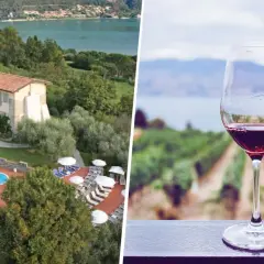 Un bicchiere di vino rosso con vigneti e lago sullo sfondo, ideale per una visita cantine Franciacorta con pernottamento.